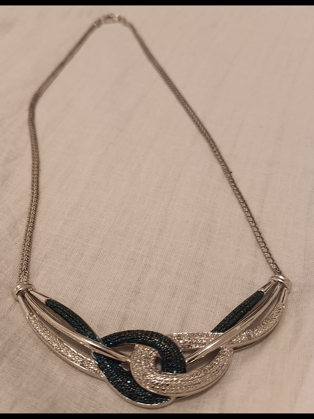 Silver Knot Necklace with Dark Teal Accents